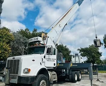 Cooper Crane Peterbilt boom truck staged with the boom extended for a truss set