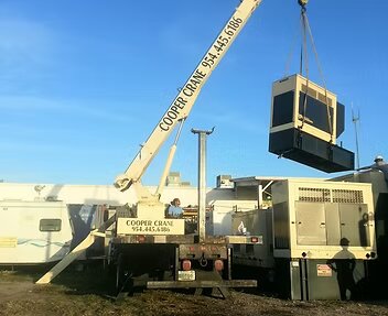 Cooper Crane boom truck setting a large industrial generator in Southeast Florida